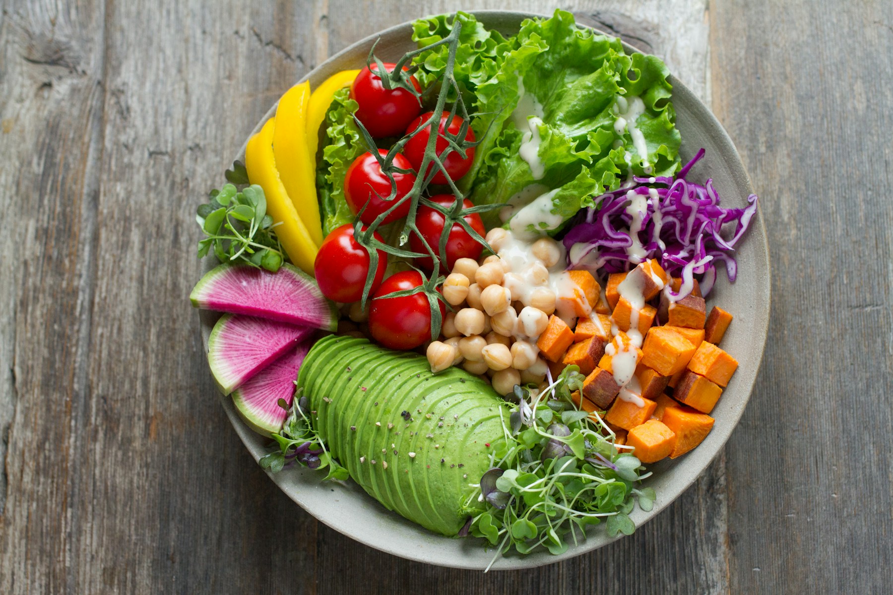A colorful bowl of vegetables and grains